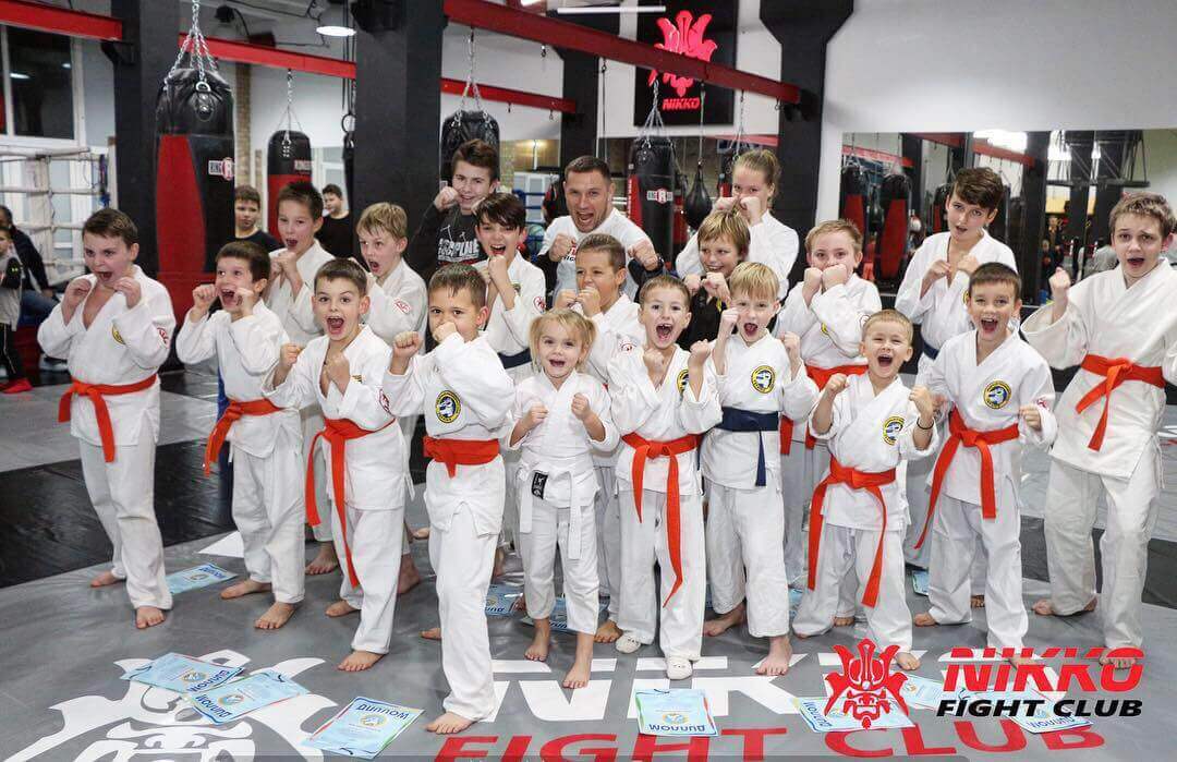 Certification of children in the martial arts club Nikko Fight Club: 11 orange and 2 blue belts
